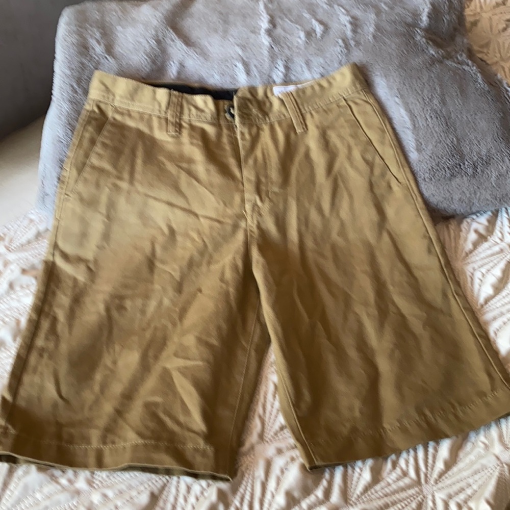 Boys Volcom tan shorts.